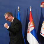 Triumphant Official Among Serbian Flags