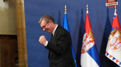 Triumphant Official Among Serbian Flags